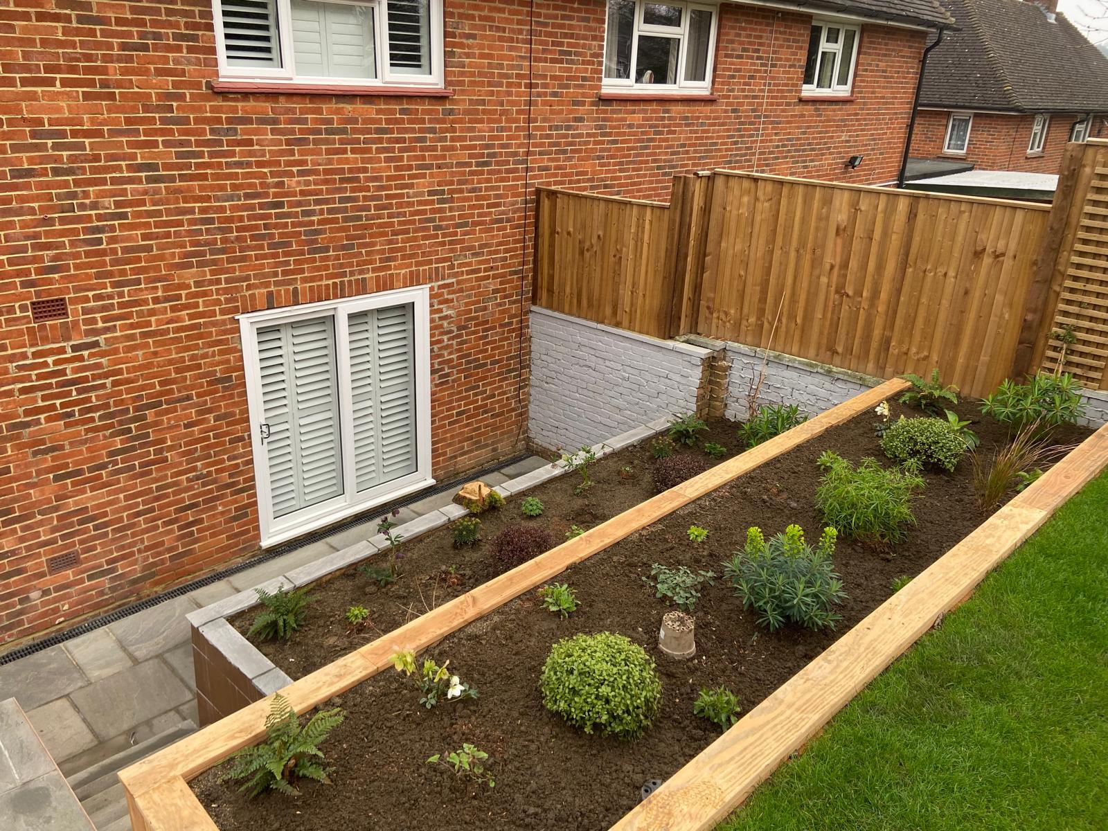 Garden with raised beds and new fencing