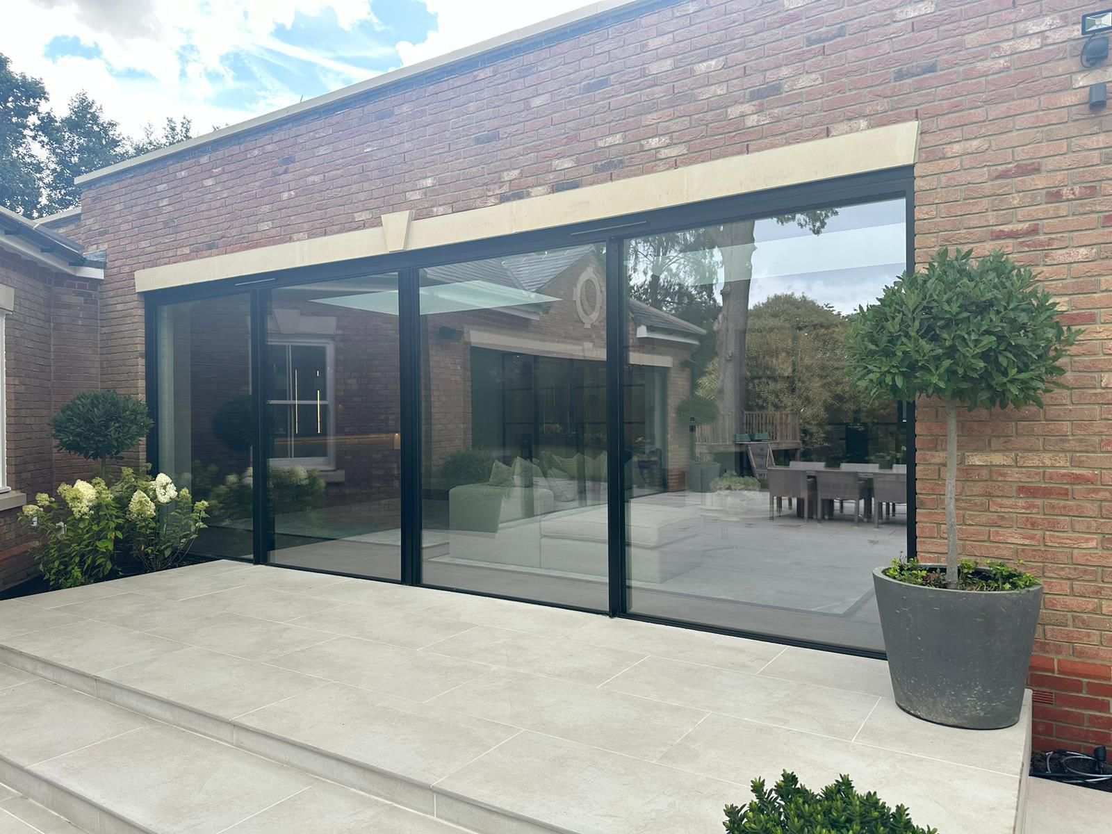 Porcelain patio adjoining glazed extension