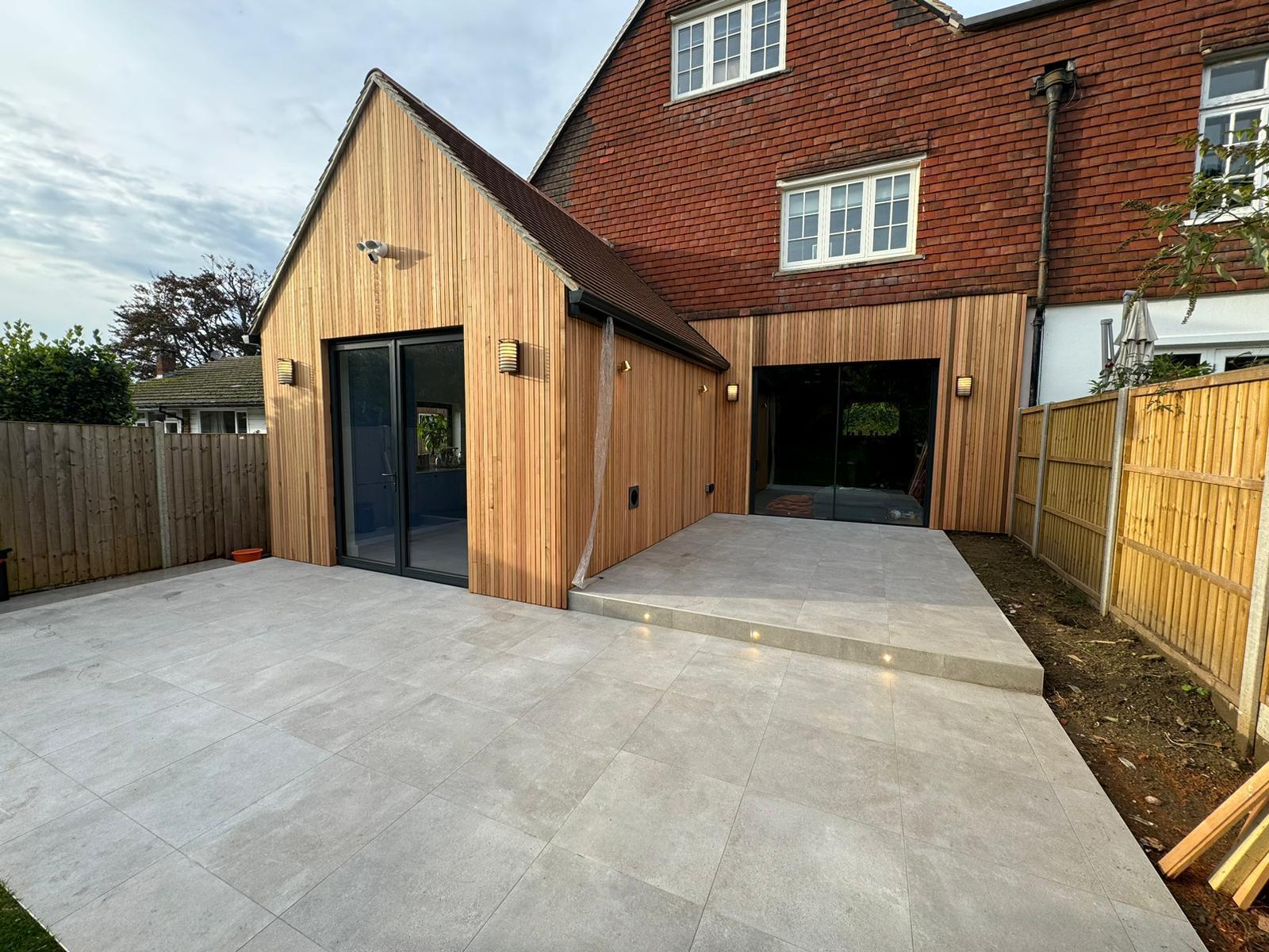 Modern porcelain patio with house extension