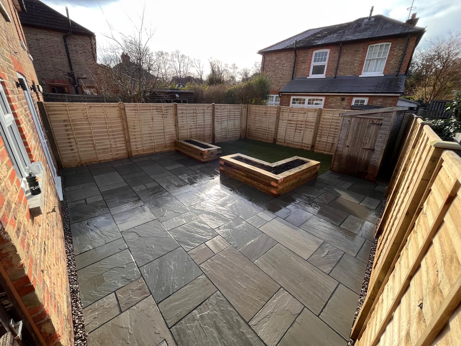 Slate patio with raised timber planters