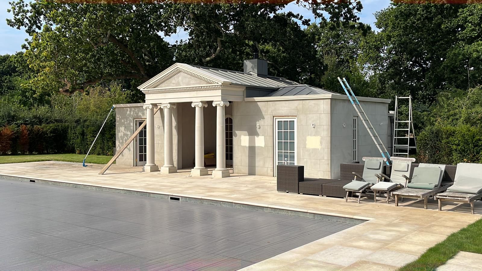 Classical pool house with stone surround